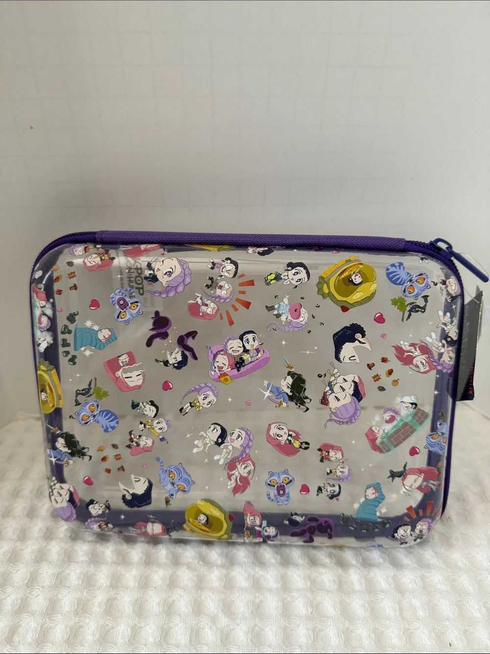 Netflix K-POP Demon Hunters Chibi-Style Clear PVC Pencil Case with Purple Trim.